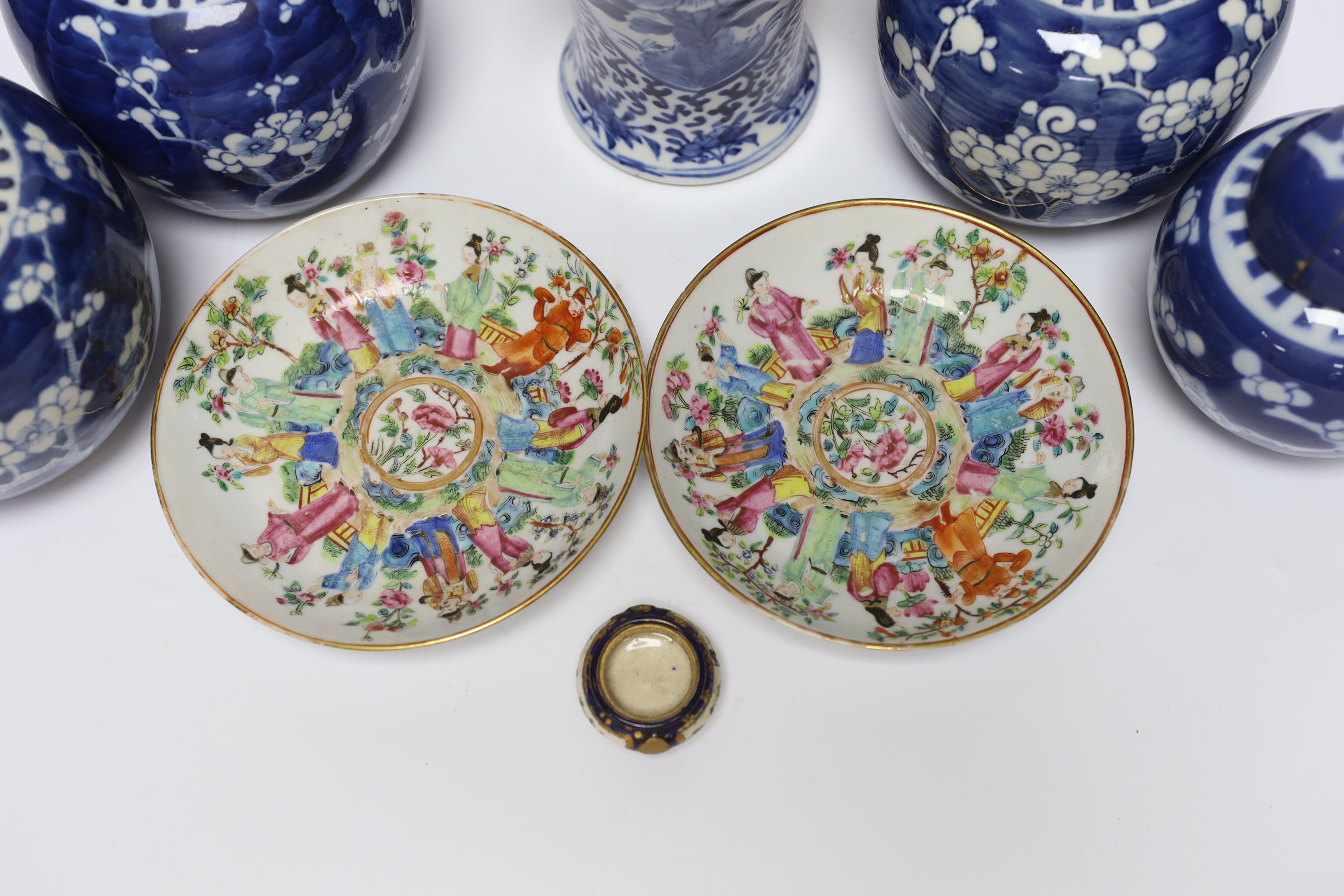 An early 20th century Chinese blue and white vase and cover, pair of 19th century Chinese famille rose dishes, four prunus jars, two covers, a Japanese Meiji period Imari dish and a small satsuma pot, some damage, talles